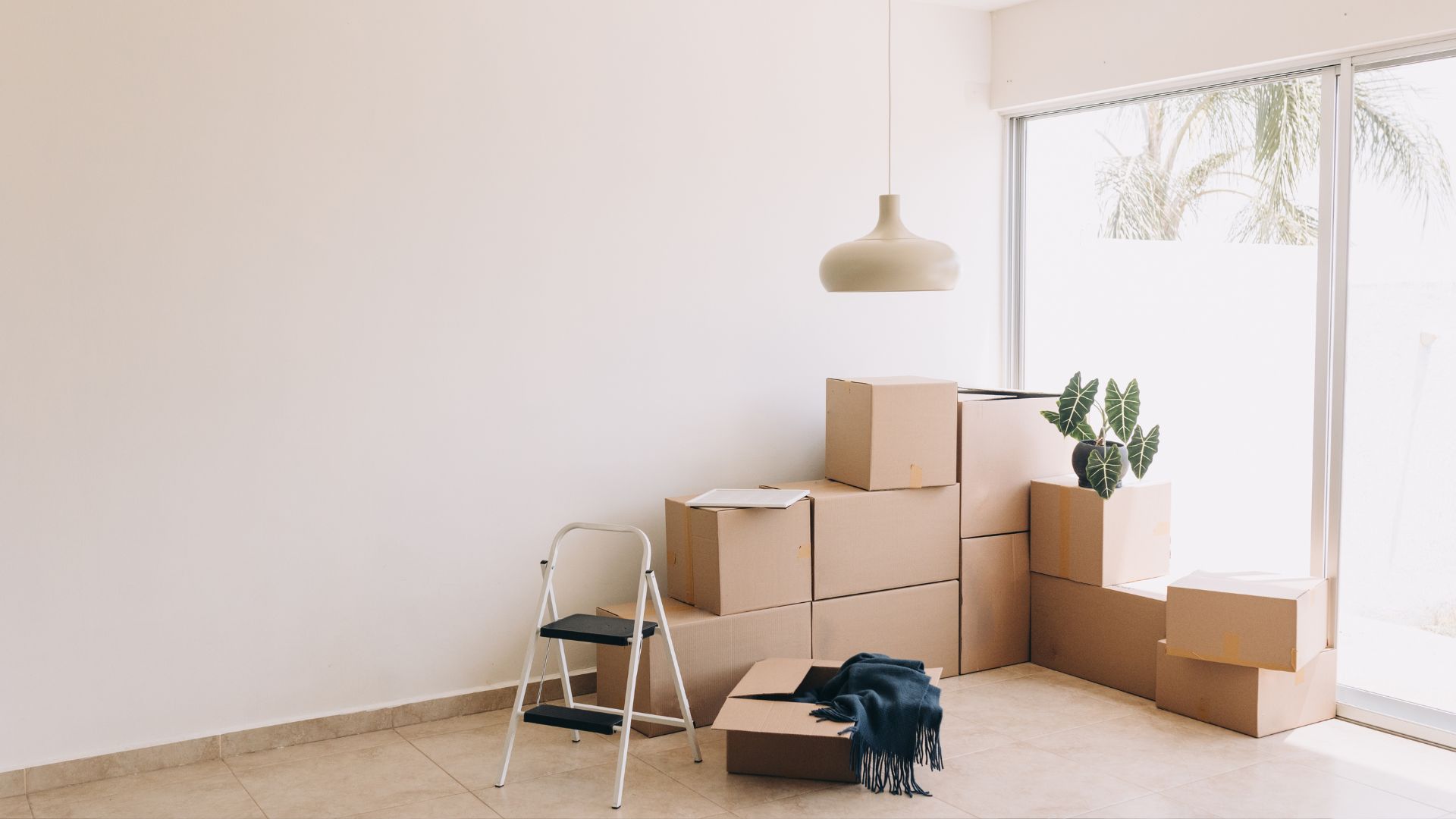 A room filled with boxes and a chair